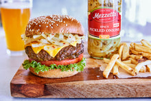 Load image into Gallery viewer, Fries and a cheeseburger topped with Mezzetta Spicy Pickled Onions
