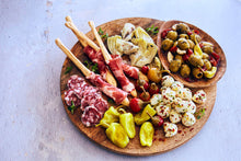 Load image into Gallery viewer, Rustic Antipasto board with salami, peperoncini, mozzarella balls, and olives
