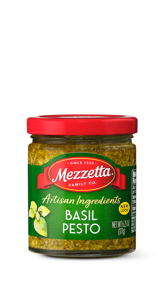 A glass jar of Mezzetta Basil Pesto displays its vibrant green color and