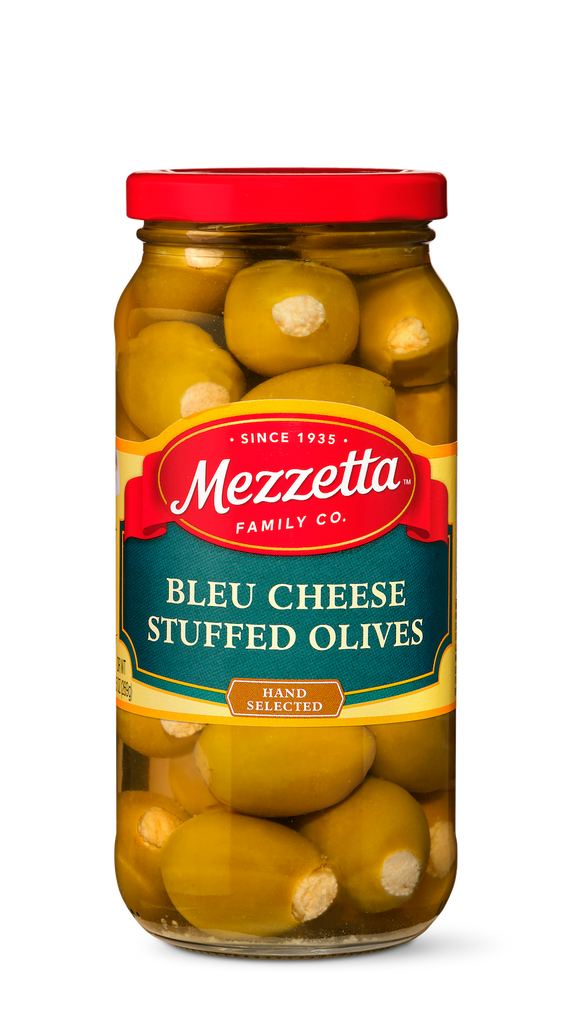 A glass jar filled with hand-selected green olives stuffed with creamy blue cheese from Mezzetta Family Co.