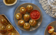 Load image into Gallery viewer, Garlic Stuffed Olive Knots served with a side of Mezzetta Marinara Sauce
