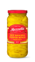 Load image into Gallery viewer, A glass jar filled with bright yellow Mezzeta brand Hot Banana Pepper Rings.