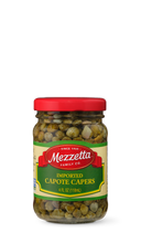 Load image into Gallery viewer, A clear glass jar displays Mezzetta brand imported capote capers. The jar features a red lid and a green label with the Mezzetta logo.