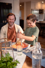 Load image into Gallery viewer, Son serving his dad a bowl of spaghetti with Mezzetta Marinara Sauce
