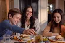 Load image into Gallery viewer, Mom and two kids enjoying sandwiches at the table