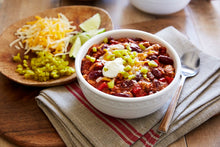 Load image into Gallery viewer, Roasted Garlic Turkey Chili topped with sour cream and Mezzetta Diced Jalapeno Peppers
