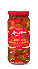 Load image into Gallery viewer, A jar of Mezzetta sliced hot cherry peppers sits against a black background.