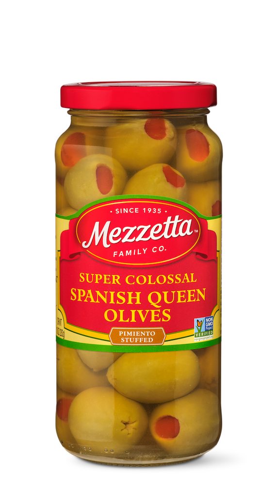 A glass jar displays pimento-stuffed, super colossal Spanish Queen olives from Mezzetta Family Co.