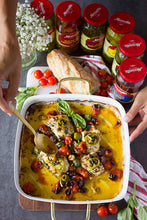 Load image into Gallery viewer, A casserole dish of Mezzetta products and cheese next to bread and Mezzetta jars
