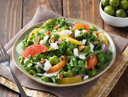 Kale salad with grapefruit and castelvetrano olives