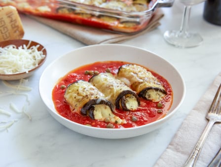 Three Spicy Eggplant Rollatini served on a bed of Mezzetta Marinara Sauce