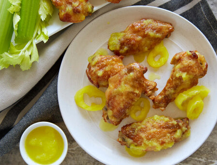 Banana pepper chicken wings on a white plate