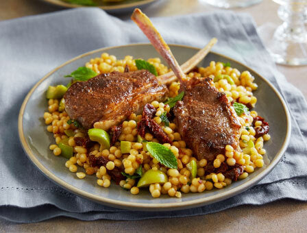 Moroccan Spiced Lamb Chomps served on a bed of couscous