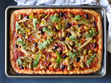 Load image into Gallery viewer, Sheet pan pizza topped with Mezzetta Artichoke Hearts, Peperoncini and Olives
