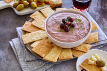 Load image into Gallery viewer, A bowl of Kalamata and White Bean Dip served with crackers
