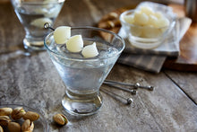 Load image into Gallery viewer, Chilled martini glass holds a classic Gibson cocktail garnished with three pickled cocktail onions. 

