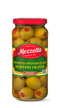 Load image into Gallery viewer, A clear jar brims with Mezzetta Spanish Queen Martini Olives, each one stuffed with a bright red pimento. 

