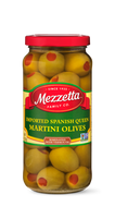 A glass jar filled with Mezzetta Spanish Queen martini olives, each one garnished with a bright red pimento. 
