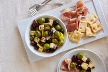 Load image into Gallery viewer, Marinated Mixed Olives with Manchego served with prosciutto and crackers. 

