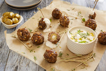 Load image into Gallery viewer, Olive and Feta Stuffed Party Meatballs served with a Tangy Yogurt sauce

