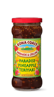 A jar of Kona Coast Paradise Pineapple Teriyaki Marinade & Grilling Sauce sits ready to add tropical flavor to your next meal. 
