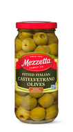 A glass jar filled with bright green, hand-selected, pitted Castelvetrano olives from Mezzetta Family Co. 
