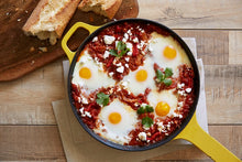 Load image into Gallery viewer, A skillet of Shakshuka served with a side of bread
