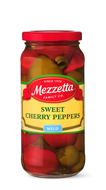 A glass jar displays whole, mild, sweet cherry peppers from Mezzetta Family Co., perfect for adding a burst of flavor to any dish. 
