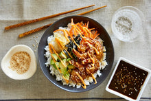 Load image into Gallery viewer, Teriyaki Shrimp Bowl with soy sauce and sparkling water on the side
